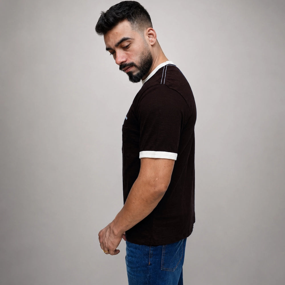 Model wearing black ribbed tee shirt, side angle view