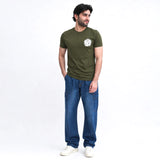 Man wearing olive graphic t-shirt with joggers casual style