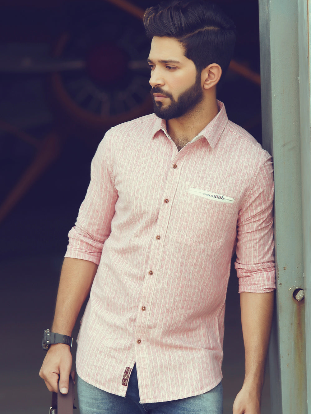 Men's pink shirt, side view with jeans