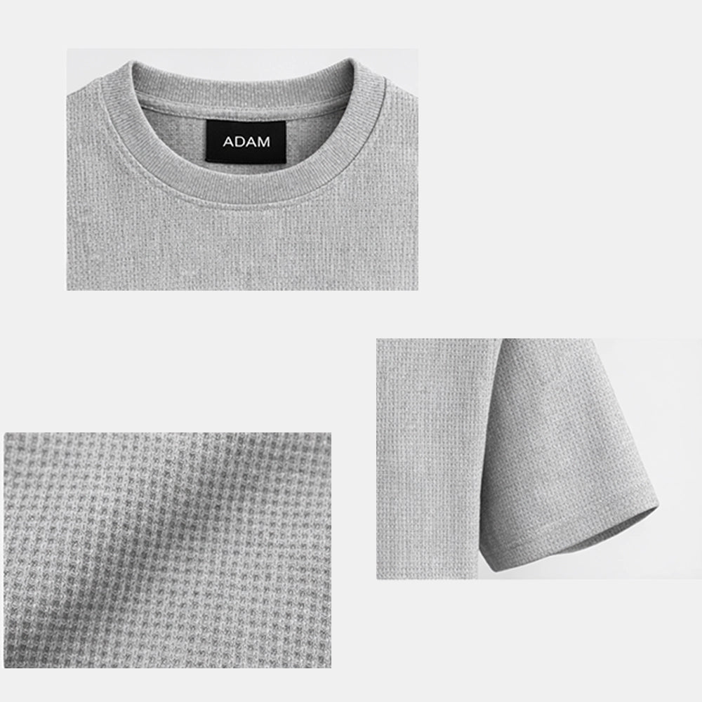 Grey t-shirt folded with fabric texture detail