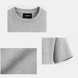Grey t-shirt folded with fabric texture detail