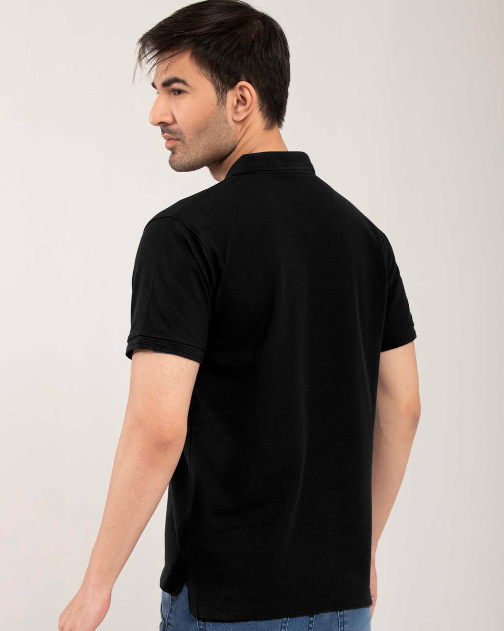 ADAM Men's Black Regular Fit Polo Shirt – Side View Showing Ribbed Cuffs and Hem Detail