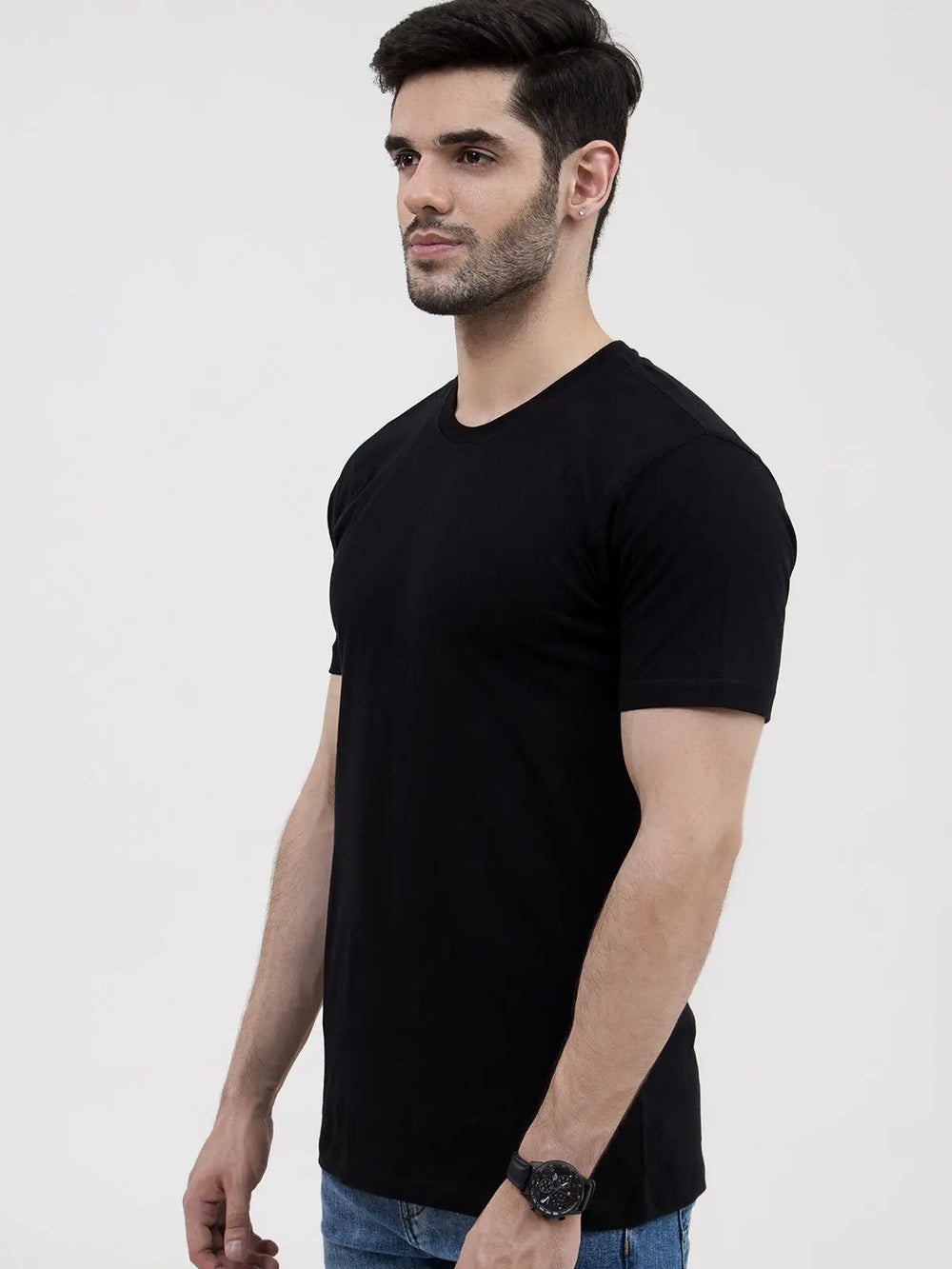 Athletic man in plain black round neck t-shirt, full body studio shot, white background