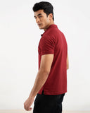 Man in maroon polo shirt, side view