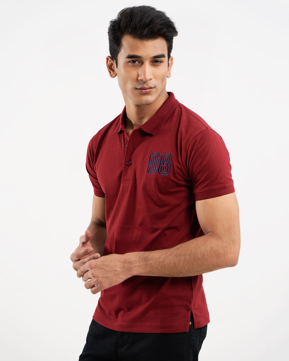 Man in maroon polo shirt, back view