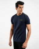Man in navy blue t-shirt with shoulder stripe, side view