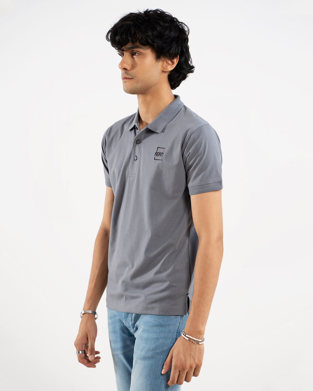 Man in grey polo shirt, side view