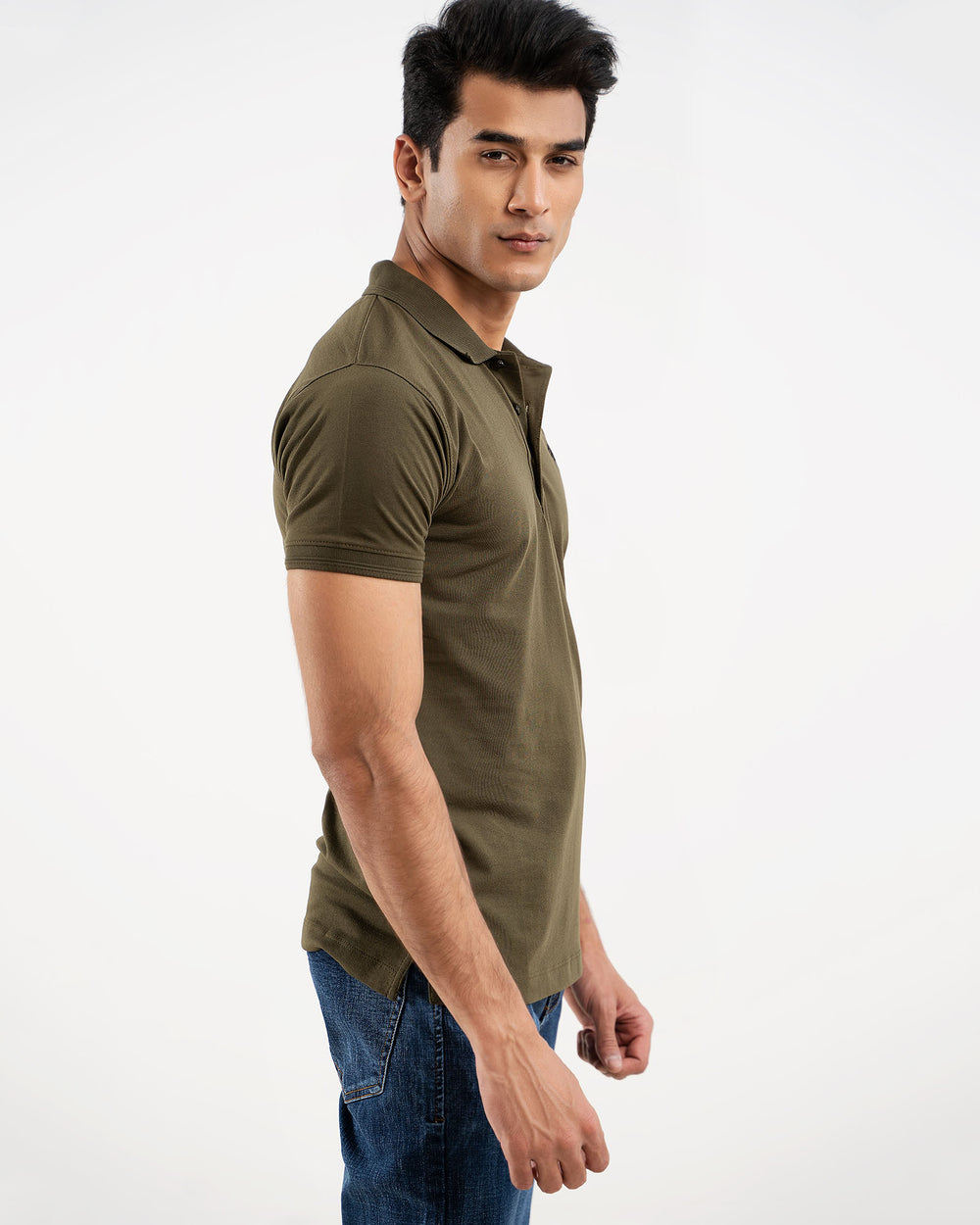 Man in olive green polo shirt, side view