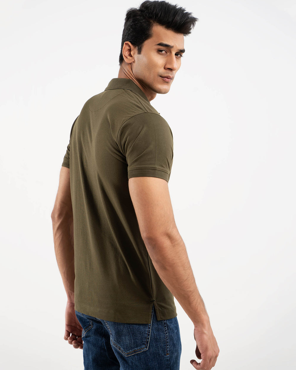 Man in olive green polo shirt, back view
