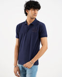 Man in navy blue polo shirt, side view