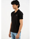 Man in black polo shirt, side view