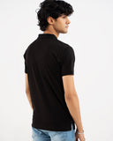 Man in black polo shirt, back view