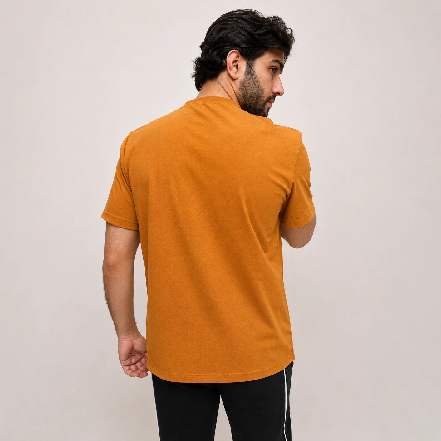Back view of ADAM mesh jumper tee showing relaxed drape and ribbed neckline 