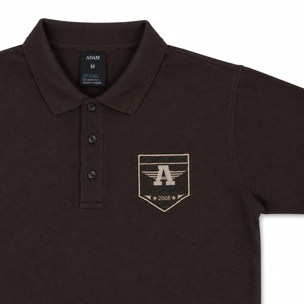 Brown embroidered polo shirt collar and button placket close-up, ADAM Clothing