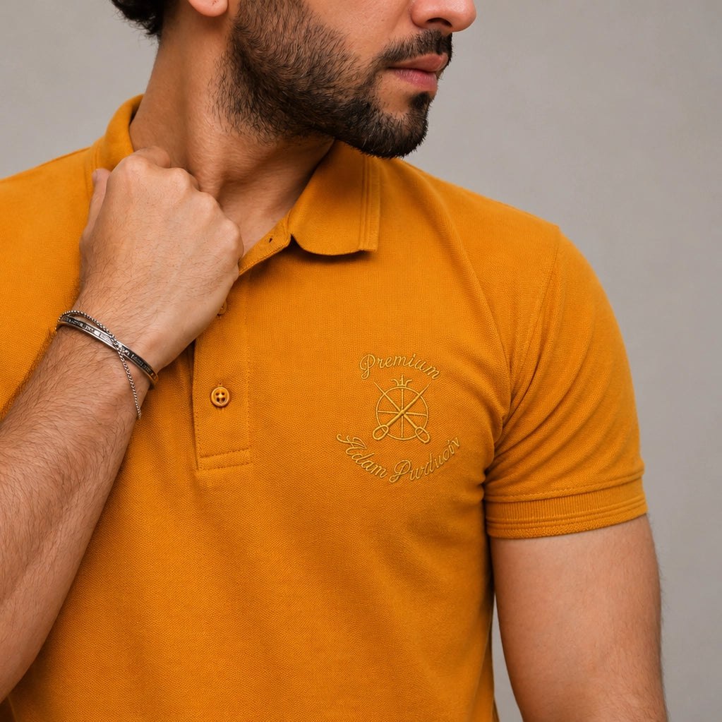 ADAM mustard polo shirt close-up showing tipping collar and stitching