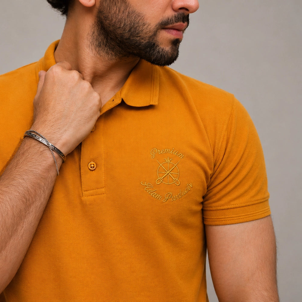 ADAM mustard polo shirt close-up showing tipping collar and stitching