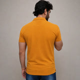 Mustard polo shirt back view showing regular fit and fabric texture