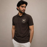 Brown embroidered polo shirt close-up showing chest embroidery detail and ribbed collar