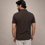 Brown polo shirt back view showing regular fit and ribbed cuff stitching