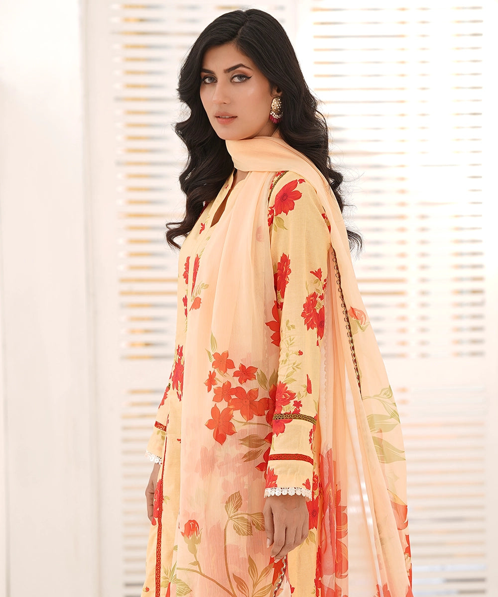women orange floral embroidered suit side view
