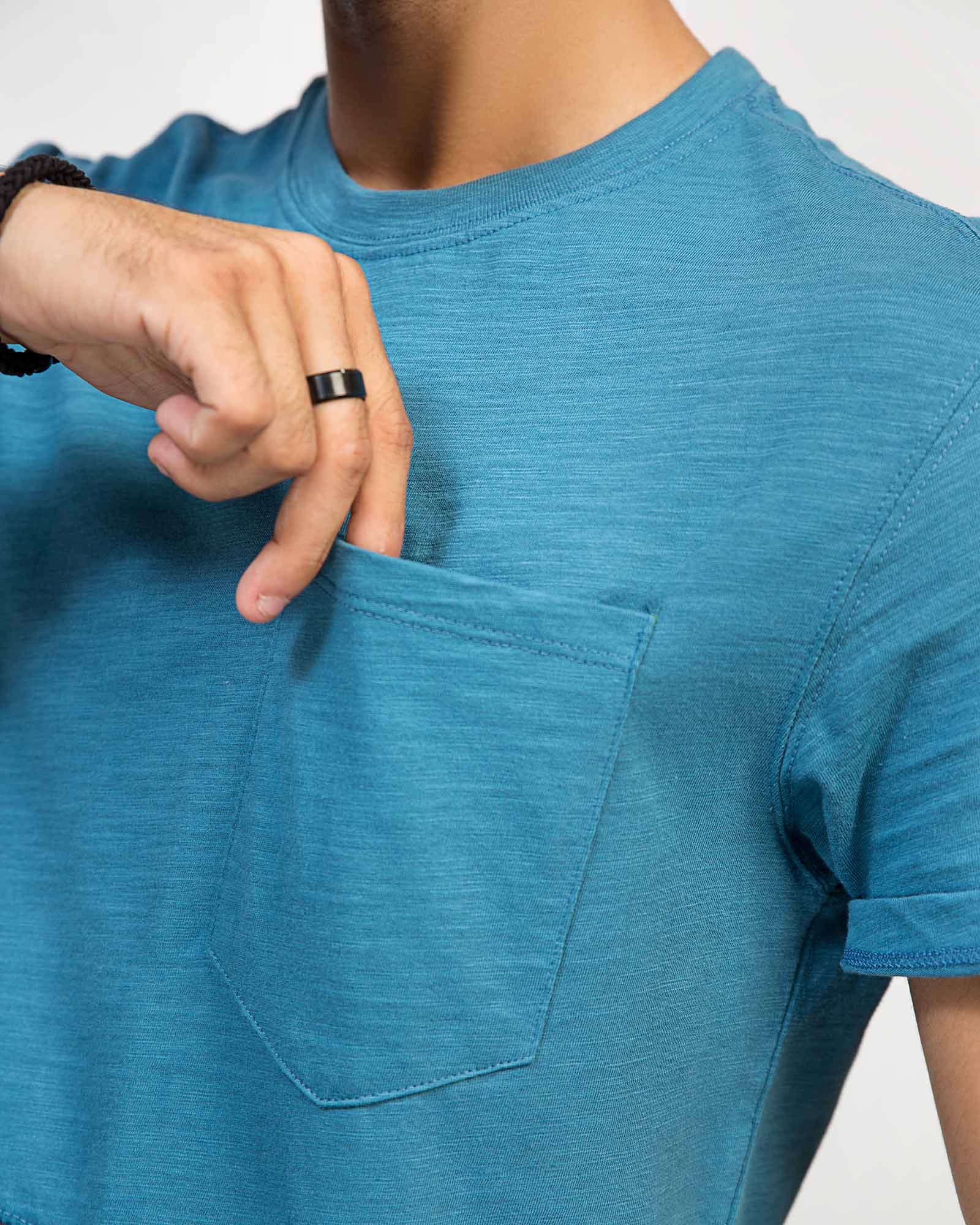 Close-up of chest pocket detail on blue color block t-shirt – ADAM Clothing