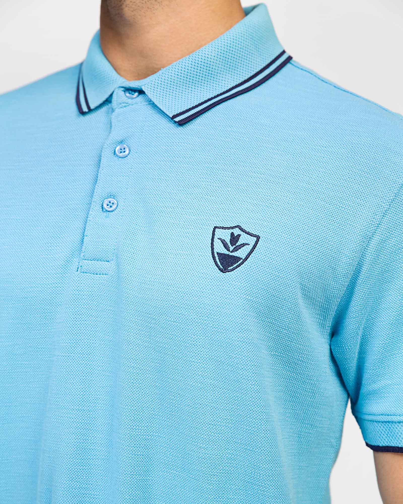 ADAM Men's Sky Blue Polo – Tipping Collar Detail and Chest Logo Close-Up
