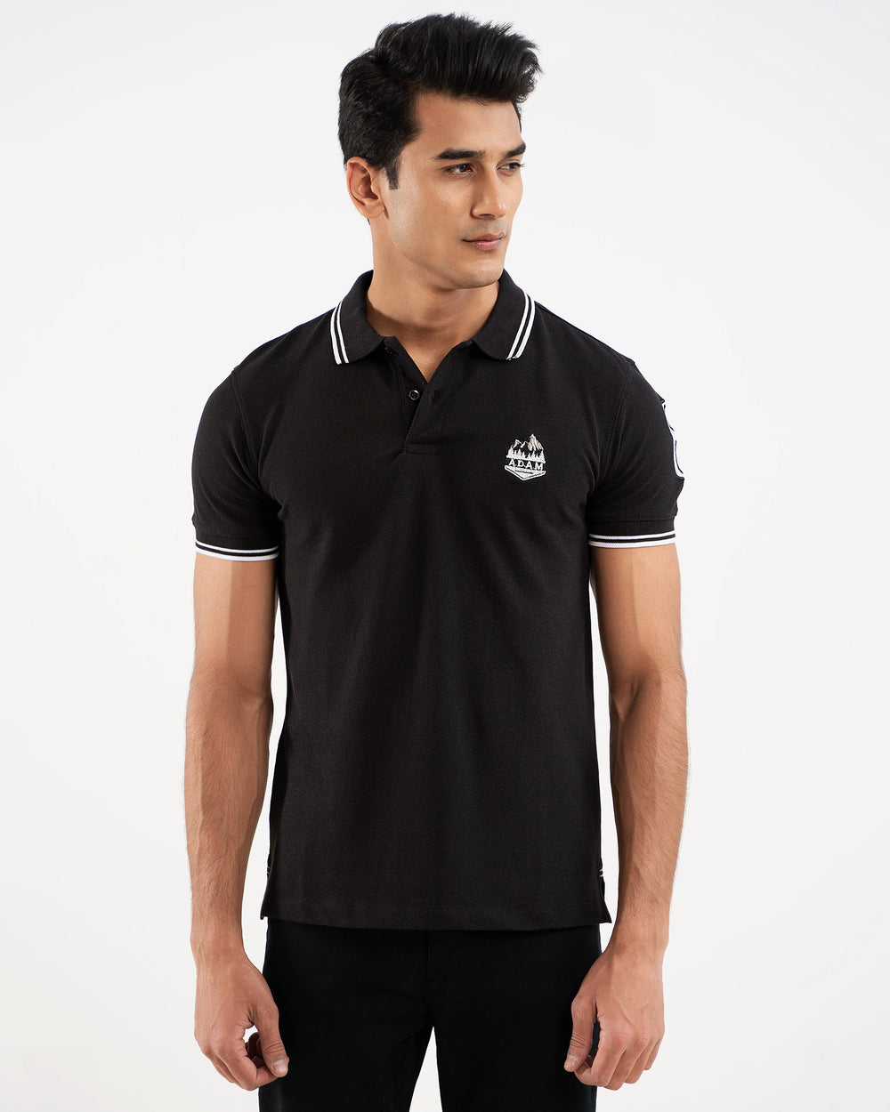 Black polo shirt, white tipping collar, back view