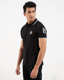 Black polo shirt, white tipping collar and cuffs, embroidered crest logo, "8" on sleeve, front
