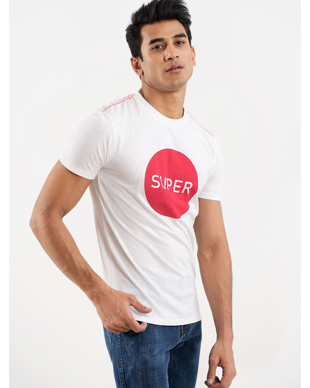 Man in white SUPER logo t-shirt, side view hand in pocket