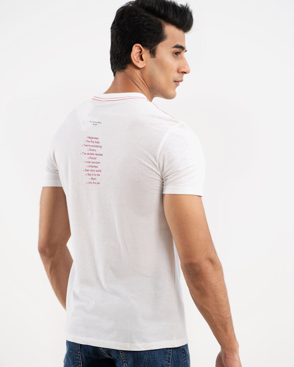 Man in white t-shirt with small SUPER text on back, back view